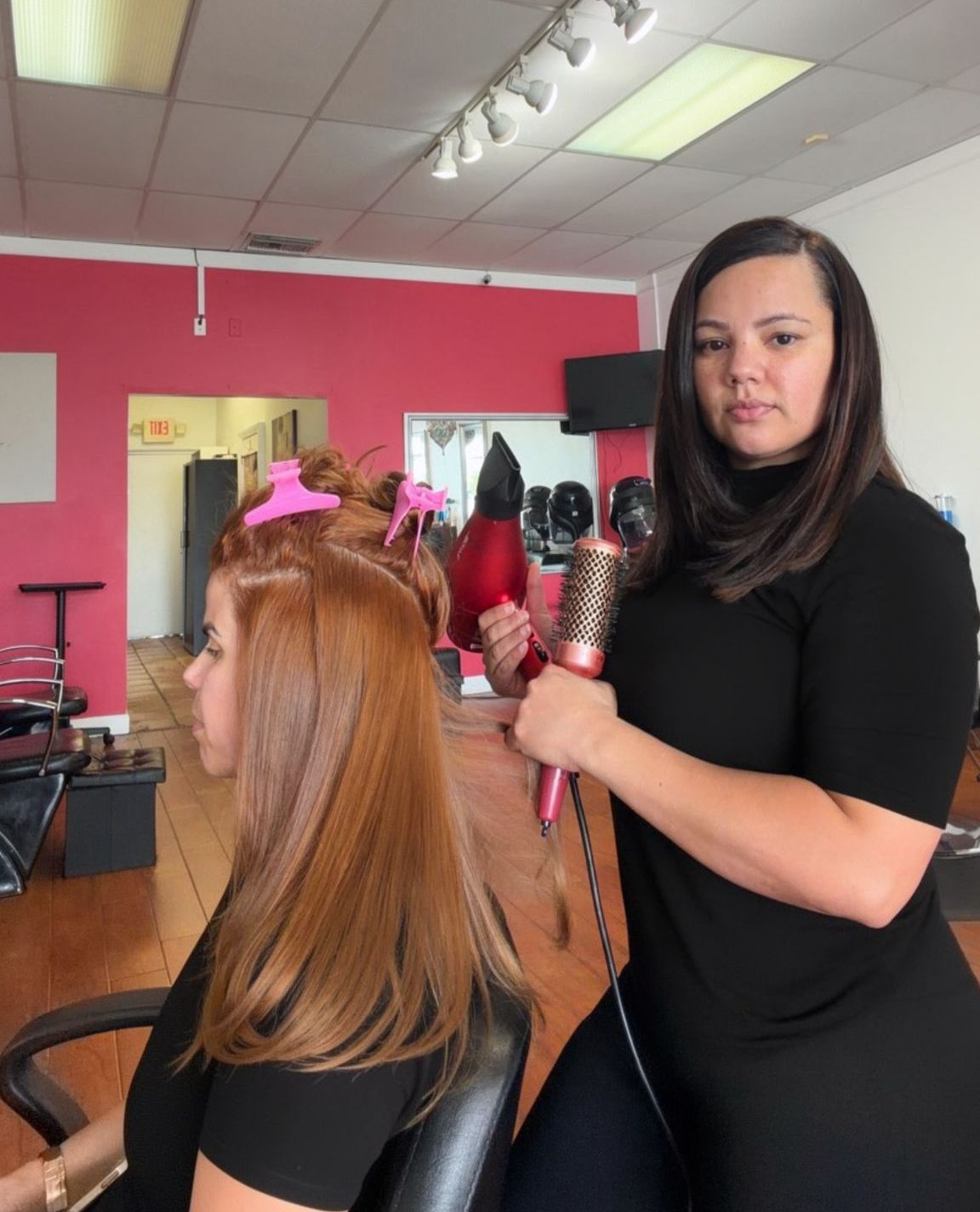 Dayhiana Calcano, Cayena Beauty Salon owner and master stylist, styling a client
